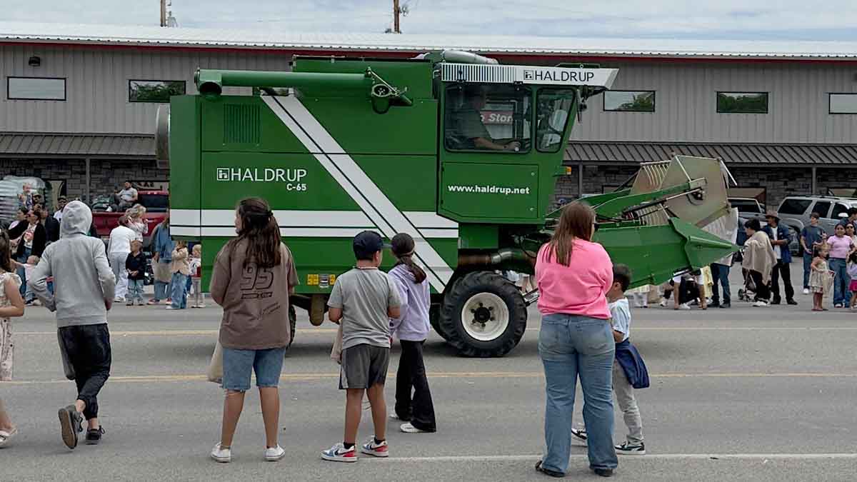 A show of a new combine going down the road.