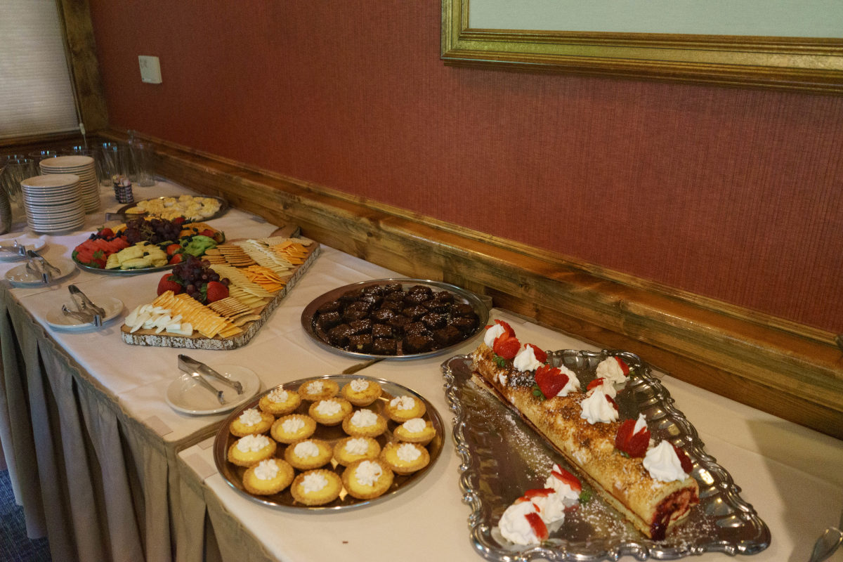 Catered food from Cottonwood Grille including lemon tartlets and a rolled cake