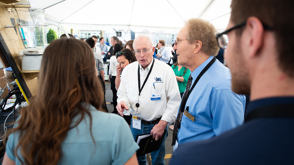 Two judges examining a presentation.