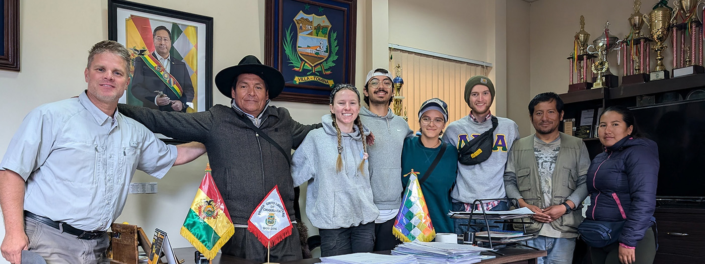 Engineering students post with the mayor of Potreros.