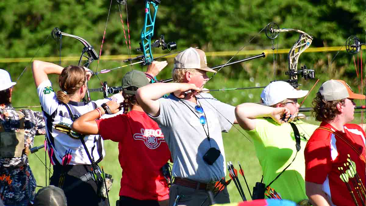 Young people shooting arrows.